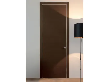 Porta a battente in legno Wengè e stipite con coprifili alluminio Trait di Albed